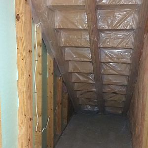 Under-stairs wood rack