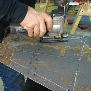 All you need is a metal cutting blade in your sabre saw