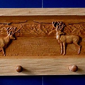 Coat Rack with carved Wilderness Scene