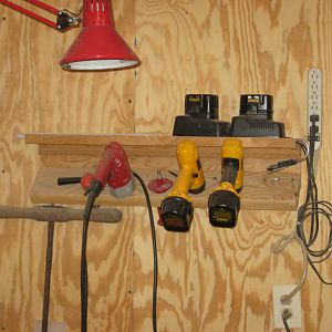 Portable drills in wall rack