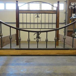 walnut and wrought iron bed