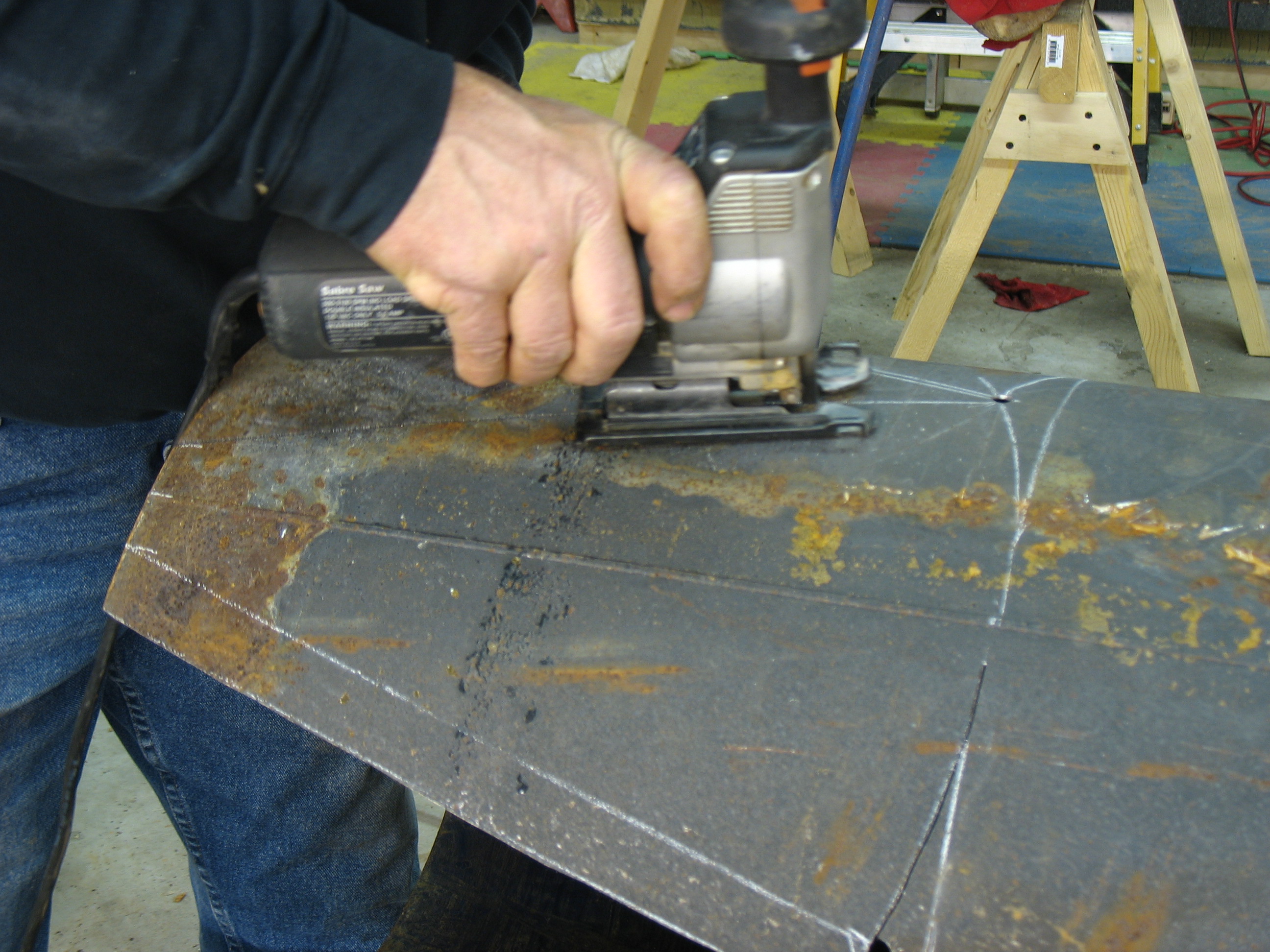 All you need is a metal cutting blade in your sabre saw