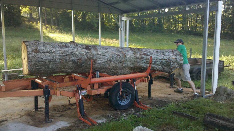 getting one of the logs in position on the mill