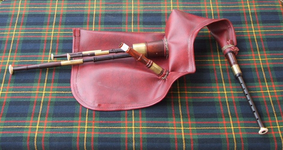Northumbrian olde-style pipes tied into Naugahyde bag