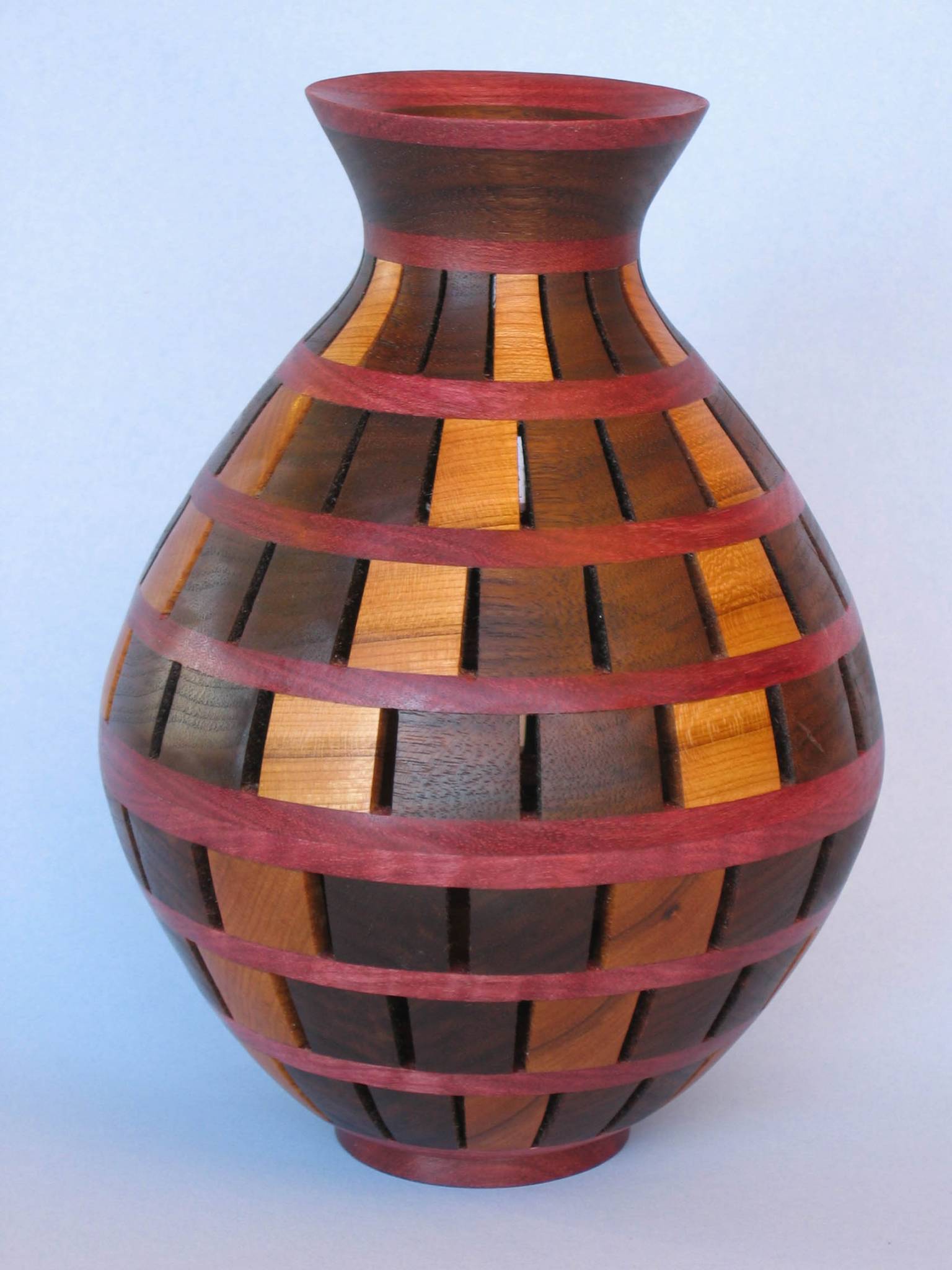 scrolled open segmented vase