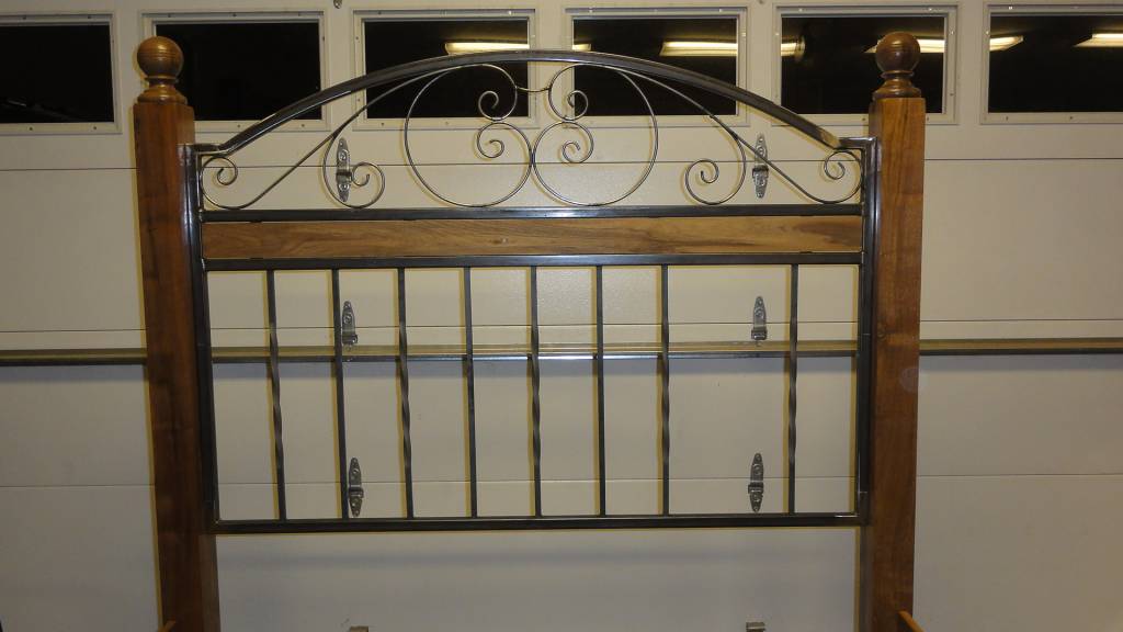 walnut and wrought iron bed