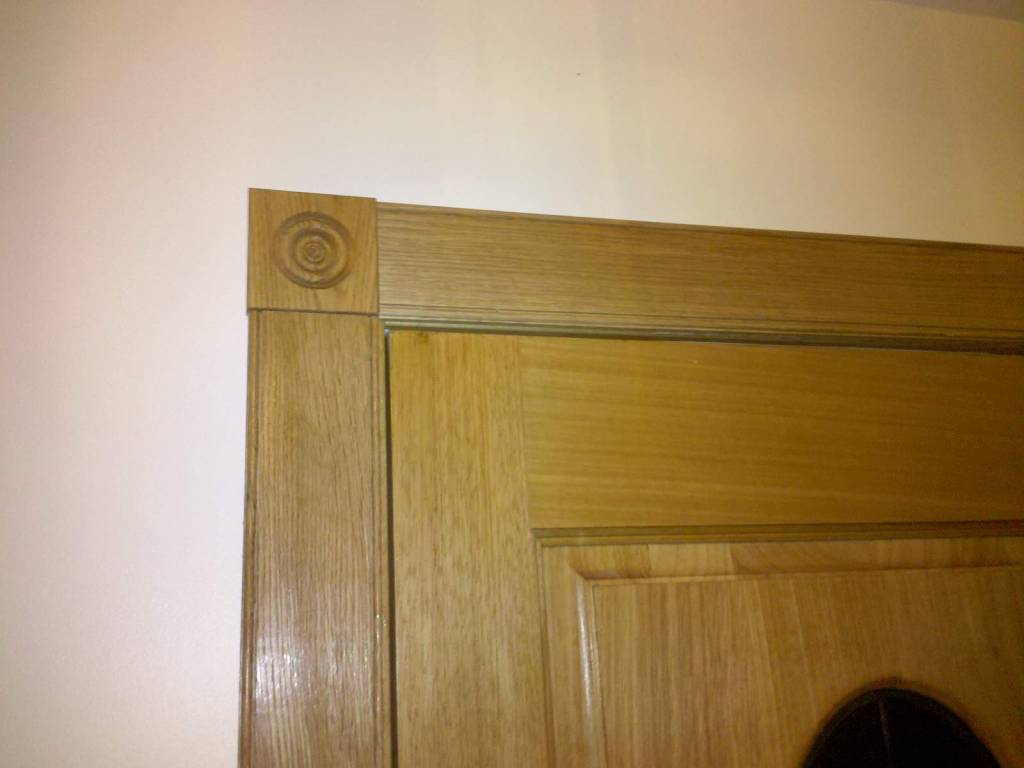 Door trim with rosettes