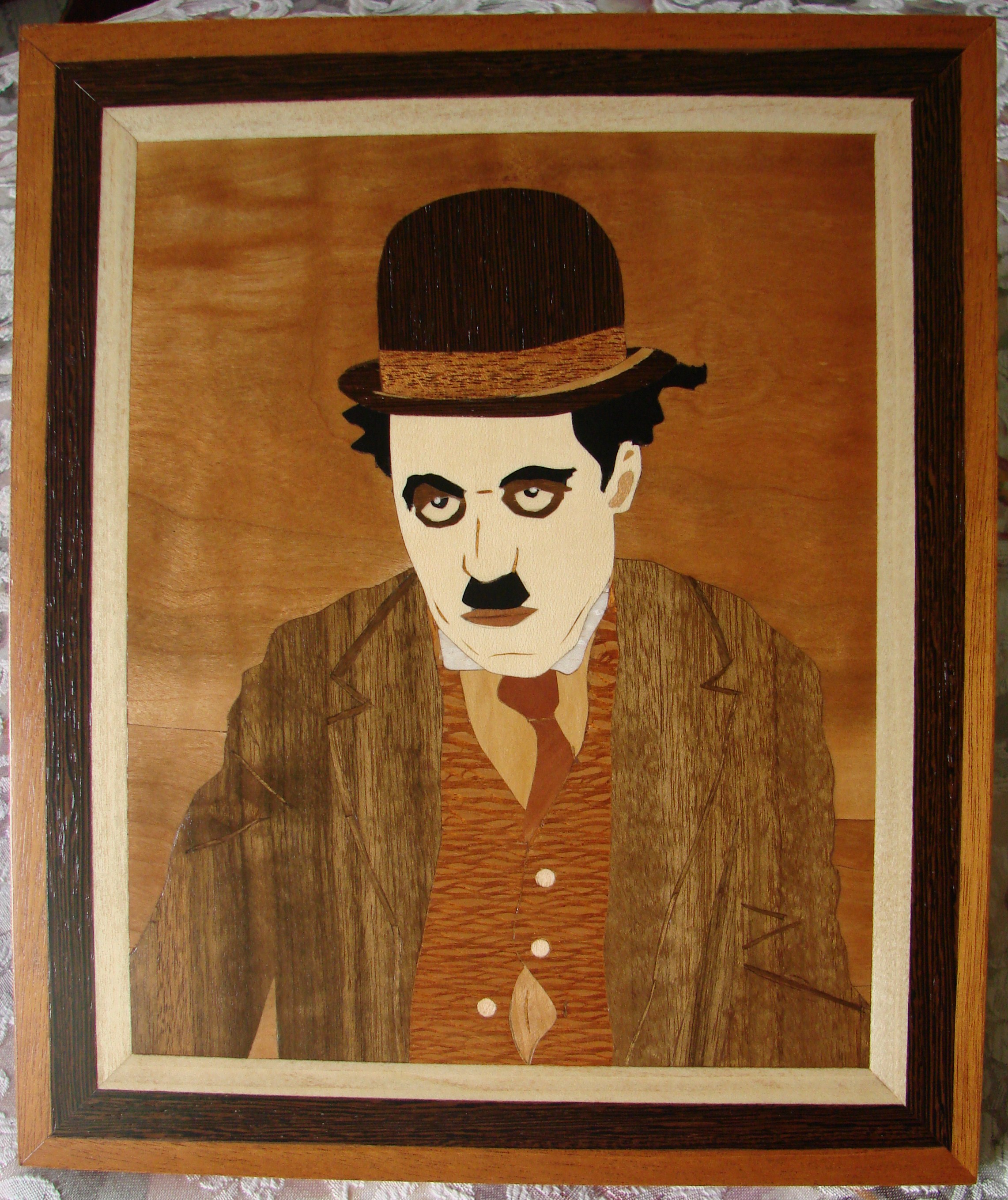 Marquetry work done in 2008. Image of Charlie Chaplin that my son, Christop