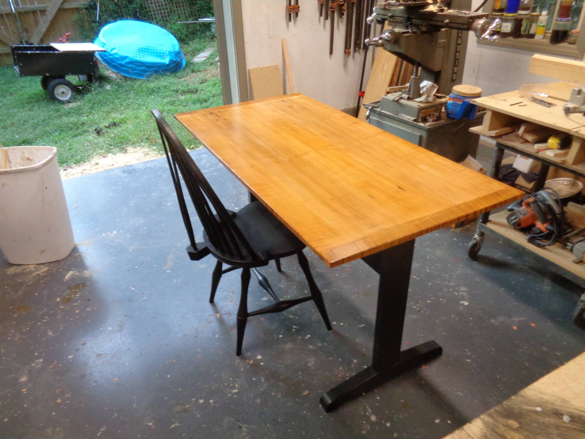 Trestle table with curly top