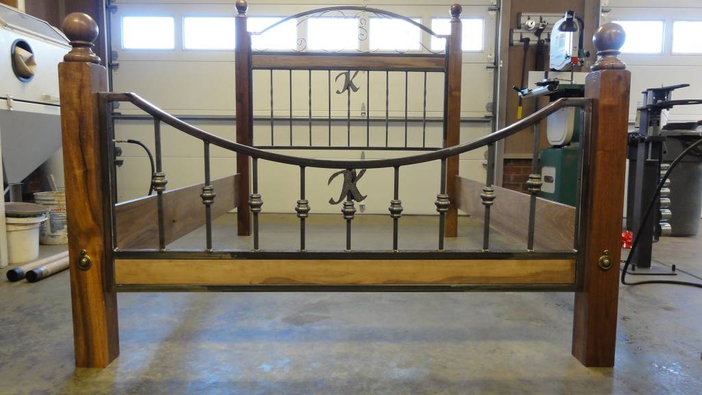 walnut and wrought iron bed