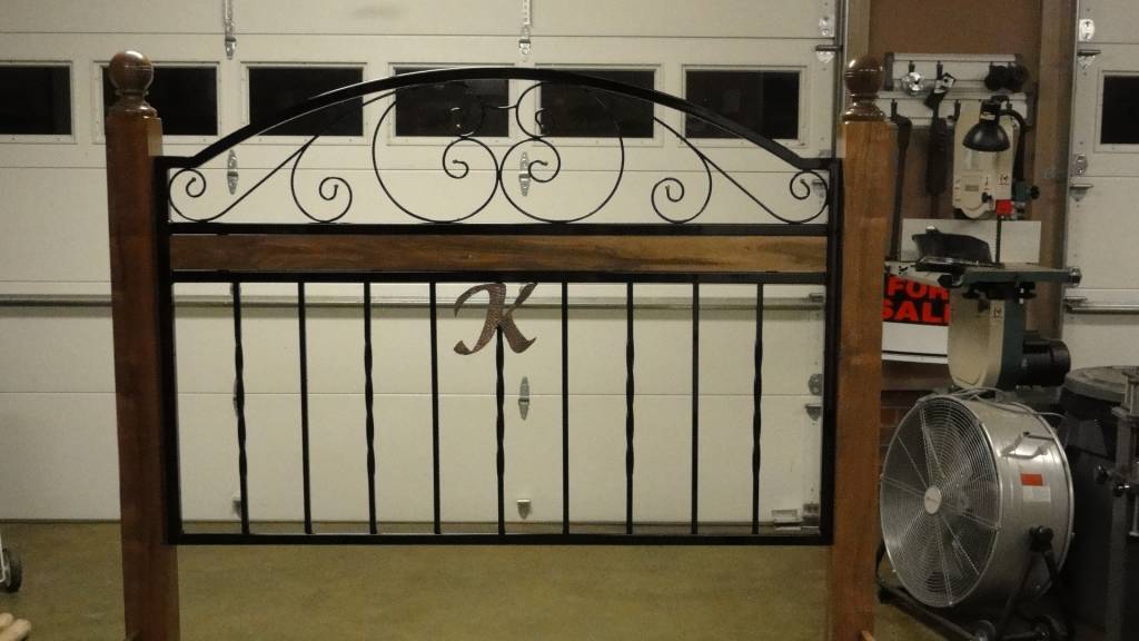 walnut and wrought iron bed