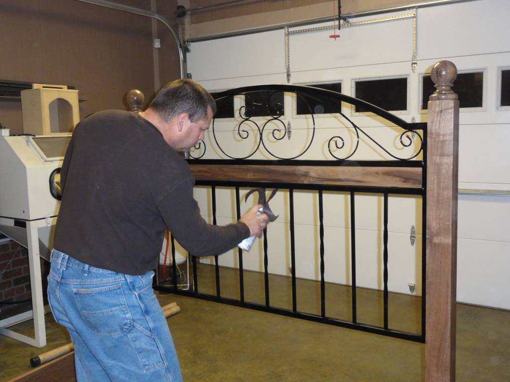 walnut and wrought iron bed